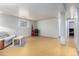 A partially finished basement with light walls, flooring, and a seating area at 4520 E 112Th Pl, Thornton, CO 80233
