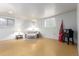 Finished basement with ample space, neutral decor, and two windows at 4520 E 112Th Pl, Thornton, CO 80233