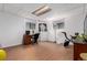 Finished basement space with desk, workspace, and home gym equipment at 4520 E 112Th Pl, Thornton, CO 80233