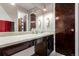 Bathroom featuring a large mirror, vanity with storage, and modern fixtures at 4520 E 112Th Pl, Thornton, CO 80233