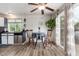 Cozy dining area featuring lots of natural light, views to the backyard, and vinyl floors at 4520 E 112Th Pl, Thornton, CO 80233