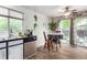 Bright dining area with a table, plants, and sliding glass doors to the outdoor patio at 4520 E 112Th Pl, Thornton, CO 80233