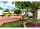 Charming home with a unique xeriscaped front yard, mature trees, and a welcoming bench at 4520 E 112Th Pl, Thornton, CO 80233