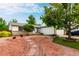 Charming home with a unique xeriscaped front yard, mature trees, and a welcoming two-car garage at 4520 E 112Th Pl, Thornton, CO 80233