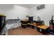 Basement storage room with containers and folding table for organization at 4520 E 112Th Pl, Thornton, CO 80233