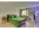 Comfortable bedroom with neutral tones and bright, natural light at 17595 E Mansfield Ave # 1331L, Aurora, CO 80013