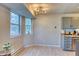 Breakfast nook with large windows and laminate floors at 17595 E Mansfield Ave # 1331L, Aurora, CO 80013