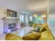 Cozy living room with stone fireplace, modern lighting, and comfortable seating at 17595 E Mansfield Ave # 1331L, Aurora, CO 80013