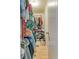 Efficient walk-in closet with ample storage and natural light, designed for optimal organization at 17595 E Mansfield Ave # 1331L, Aurora, CO 80013
