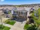 A vibrant neighborhood with mature trees and manicured lawns at 2410 Morningview Ln, Castle Rock, CO 80109