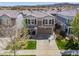 An aerial view of the exterior of the home in a vibrant, residential neighborhood at 2410 Morningview Ln, Castle Rock, CO 80109