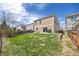 Large backyard with a lawn, patio, stock tank pool and privacy fence at 2410 Morningview Ln, Castle Rock, CO 80109