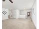 Spacious carpeted room with multiple entryways and light-colored walls at 2410 Morningview Ln, Castle Rock, CO 80109
