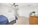 Bright bedroom offering a ceiling fan, neutral paint, and carpet flooring at 2410 Morningview Ln, Castle Rock, CO 80109