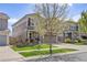 Two-story home with a manicured lawn and mature tree in a residential neighborhood at 2410 Morningview Ln, Castle Rock, CO 80109