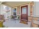 A cozy front porch with room for seating and a welcome mat at 2410 Morningview Ln, Castle Rock, CO 80109