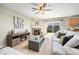 Spacious living room with modern fireplace and sliding glass door to the backyard at 2410 Morningview Ln, Castle Rock, CO 80109