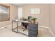 Home office with an modern desk setup, stylish chair, and neutral decor at 2410 Morningview Ln, Castle Rock, CO 80109