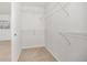Spacious walk-in closet with carpeted floors and metal shelving for optimal storage at 2410 Morningview Ln, Castle Rock, CO 80109