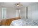 Bright bedroom with hardwood floors, a ceiling fan, and attached bathroom at 4410 S Estes St, Littleton, CO 80123