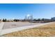 A community basketball court surrounded by trees and landscaping at 14651 Dahlia Way, Thornton, CO 80602