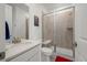 Modern bathroom features a glass shower with a built-in seat, and sleek fixtures at 14651 Dahlia Way, Thornton, CO 80602