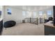 Open bonus room with carpet, featuring natural light from the windows and plenty of space at 14651 Dahlia Way, Thornton, CO 80602