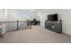 Upstairs bonus room with desk and TV area, great for office or additional living space at 14651 Dahlia Way, Thornton, CO 80602