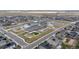 An aerial view showing a local school with a playground area surrounded by houses at 14651 Dahlia Way, Thornton, CO 80602