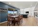 Cozy dining area featuring a table with seating for six and large windows with views at 14651 Dahlia Way, Thornton, CO 80602