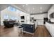 Spacious kitchen featuring stainless steel appliances, a large island, and open access to the living area at 14651 Dahlia Way, Thornton, CO 80602