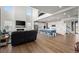 Bright, open living space with fireplace, hardwood floors and adjacent kitchen at 14651 Dahlia Way, Thornton, CO 80602