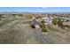 Scenic aerial view showcasing the property's expansive lot, mountain views and the well-maintained landscaping at 8700 Ehler Pkwy, Brighton, CO 80602