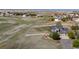 Expansive grassy lot with a charming two-story home, attached garage, and a white perimeter fence at 8700 Ehler Pkwy, Brighton, CO 80602