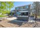 Well-maintained backyard featuring a covered hot tub, patio, seating, and gravel landscaping at 8700 Ehler Pkwy, Brighton, CO 80602