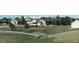 Expansive backyard with white fence, green lawns, and picturesque mountain views at 8700 Ehler Pkwy, Brighton, CO 80602