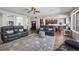 Spacious living room boasts open layout, hardwood floors, plush seating, and elegant decor at 8700 Ehler Pkwy, Brighton, CO 80602