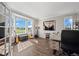 Bright office space with a large bay window offering stunning views, and hardwood floors at 8700 Ehler Pkwy, Brighton, CO 80602