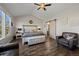 Inviting main bedroom with large windows, vaulted ceiling, cozy seating area, and ample natural light at 8700 Ehler Pkwy, Brighton, CO 80602