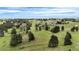 Picturesque aerial showcases the verdant, sprawling landscape surrounding the homes at 12189 N Boot Hill Dr, Parker, CO 80138