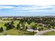 Aerial view of home featuring a large lot, mature trees, and a long driveway on a partially cloudy day at 12189 N Boot Hill Dr, Parker, CO 80138