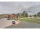 Large backyard featuring an outbuilding, firepit, and plenty of room for outdoor activities at 12189 N Boot Hill Dr, Parker, CO 80138