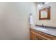 Bathroom featuring a vanity with granite countertop, undermount sink and framed mirror at 12189 N Boot Hill Dr, Parker, CO 80138