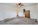 Bright bedroom featuring a closet, a bookshelf and neutral carpeting at 12189 N Boot Hill Dr, Parker, CO 80138