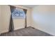 Cozy bedroom features plush carpeting and a window with modern blinds and decorative curtains at 12189 N Boot Hill Dr, Parker, CO 80138
