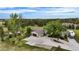 Aerial view of home featuring a large lot, mature trees, long driveway and an RV parked near the house at 12189 N Boot Hill Dr, Parker, CO 80138
