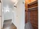 Hallway features hardwood flooring and a glimpse of a cedar closet with built-in shelving at 12189 N Boot Hill Dr, Parker, CO 80138