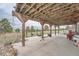 Covered patio provides ample space for outdoor dining and entertaining in the backyard at 12189 N Boot Hill Dr, Parker, CO 80138