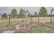 Quaint windmill offers an attractive decor element to the spacious, fenced-in backyard at 12189 N Boot Hill Dr, Parker, CO 80138