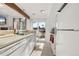 Well-lit kitchen with modern appliances and a view to the outside patio area at 4899 S Dudley St # 3, Littleton, CO 80123